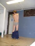 swimmer dude wearing greay Tommy Hilfiger briefs, Addidas sweats (rear) (back)