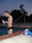 black speedo and drinking an antioxidant smoothie before the morning swim