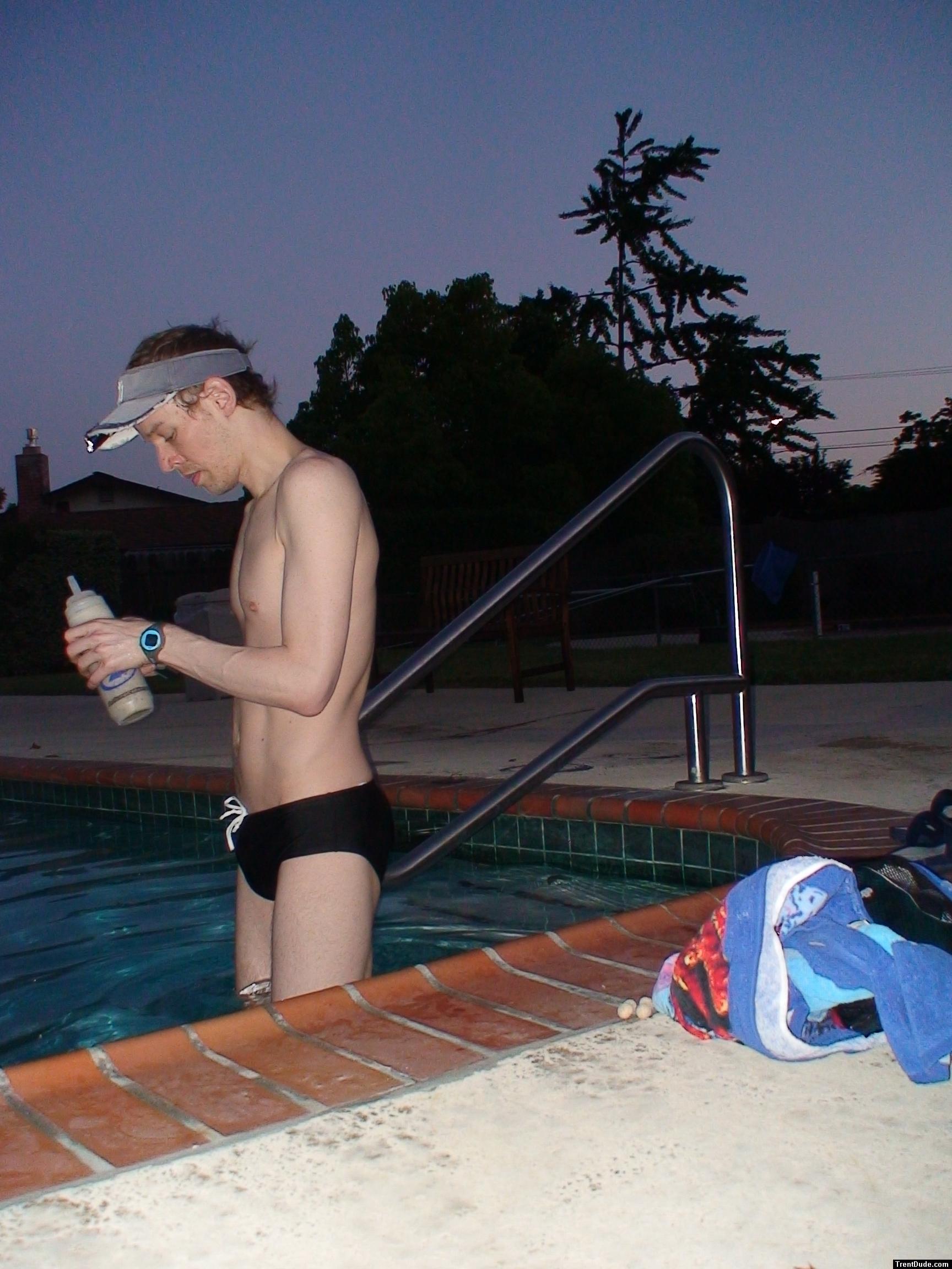 black speedo and drinking an antioxidant smoothie before the morning swim