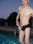 a zip-lock bag of peanuts near the black speedo