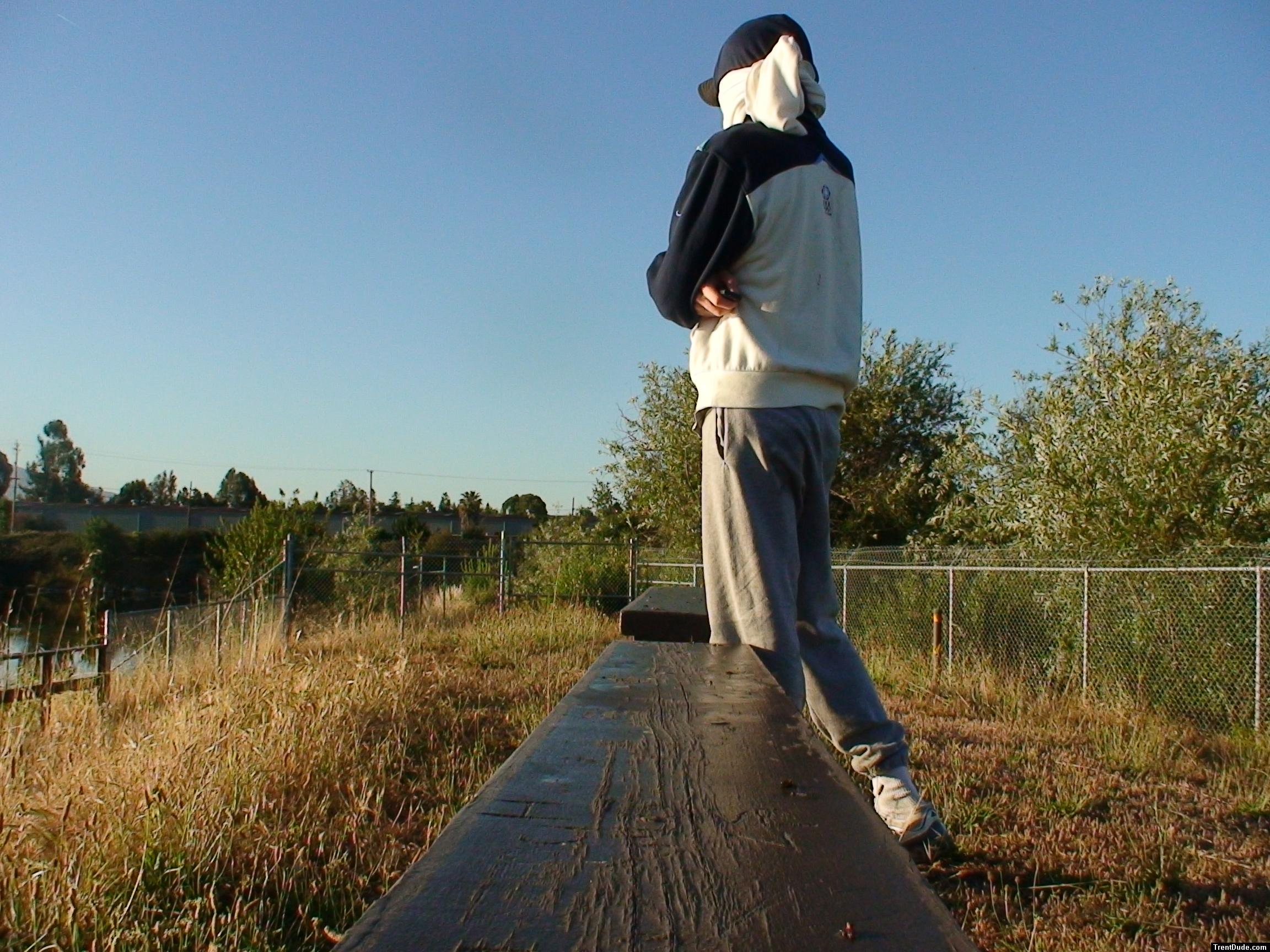 Sweats at the park (wearing a hood protection from UVA/UVB rays from sun) (rear)