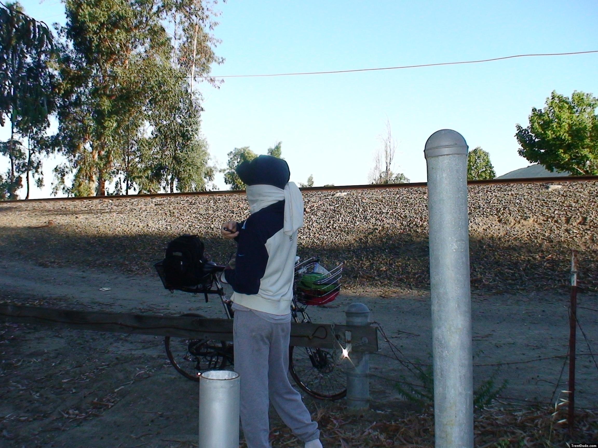 Sweats at the park (face wrapped in a scarf and hat)
