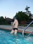 Stretching in black speedo