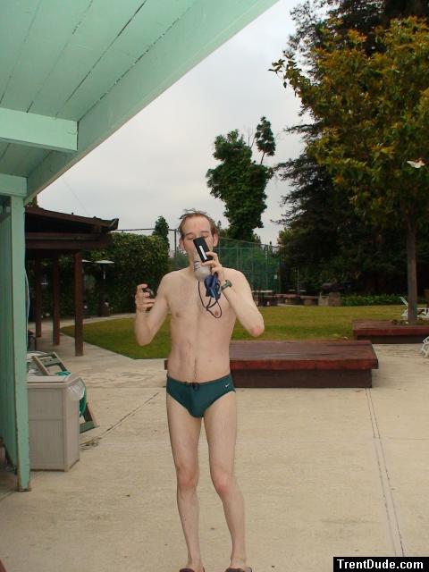 Green Nike speedo swim brief after a swim, drinking antioxidant smoothie