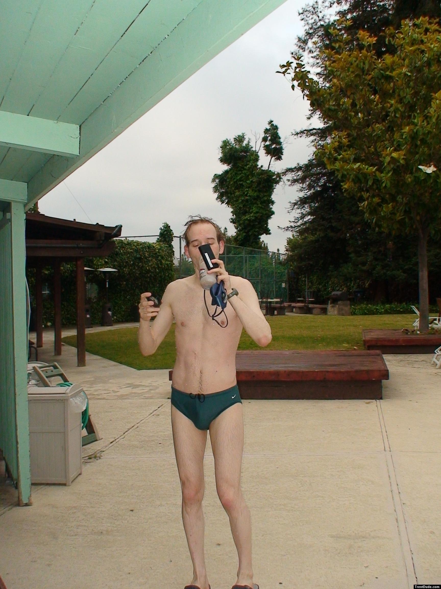 Green Nike speedo swim brief after a swim, drinking antioxidant smoothie