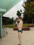 Green Nike speedo swim brief after a swim, drinking antioxidant smoothie