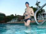wearing a Nike black/blue speedo swim brief (unshaven)