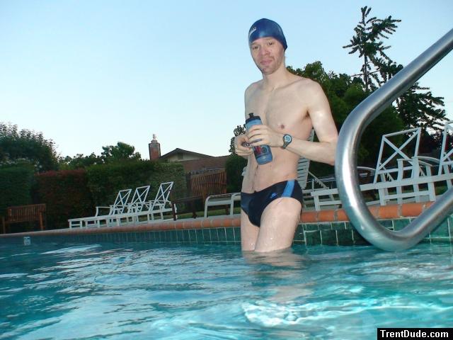 wearing a Nike black/blue speedo swim brief (unshaven)
