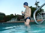 wearing a Nike black/blue speedo swim brief (unshaven)