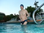 wearing a Nike black/blue speedo swim brief (unshaven)