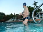 wearing a Nike black/blue speedo swim brief (unshaven)