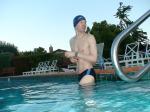 wearing a Nike black/blue speedo swim brief (unshaven)