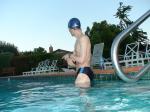 wearing a Nike black/blue speedo swim brief (neck)