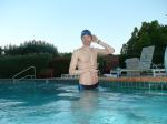 wearing a Nike black/blue speedo swim brief (unshaven)