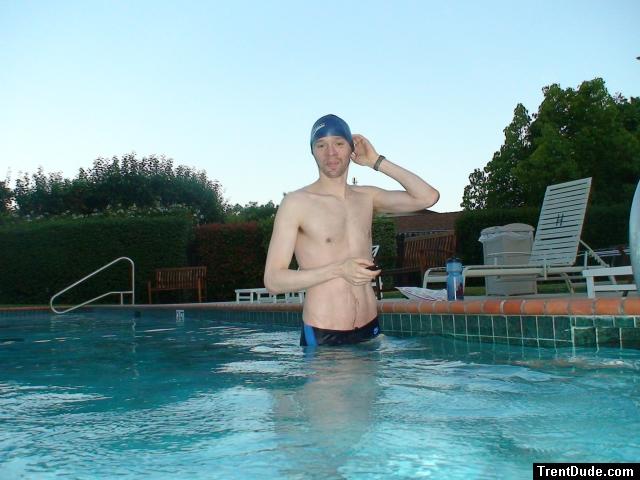 wearing a Nike black/blue speedo swim brief (unshaven)