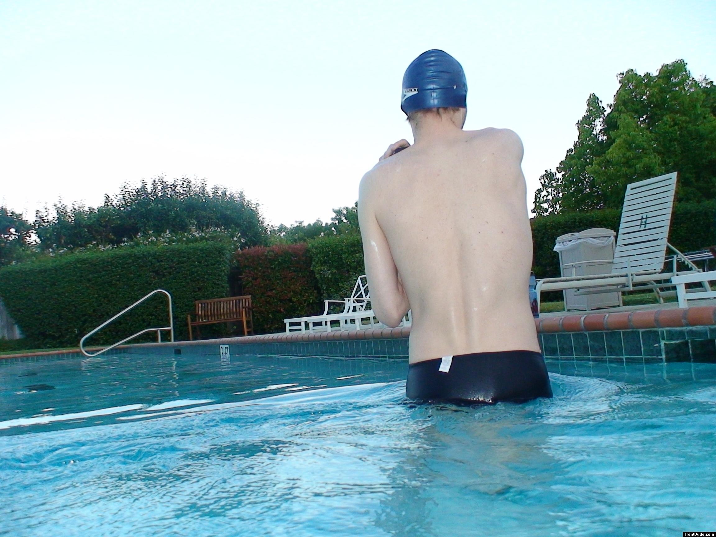 wearing a Nike black/blue speedo swim brief
