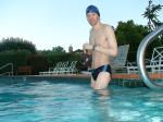 wearing a Nike black/blue speedo swim brief (unshaven)