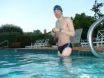 wearing a Nike black/blue speedo swim brief (unshaven)