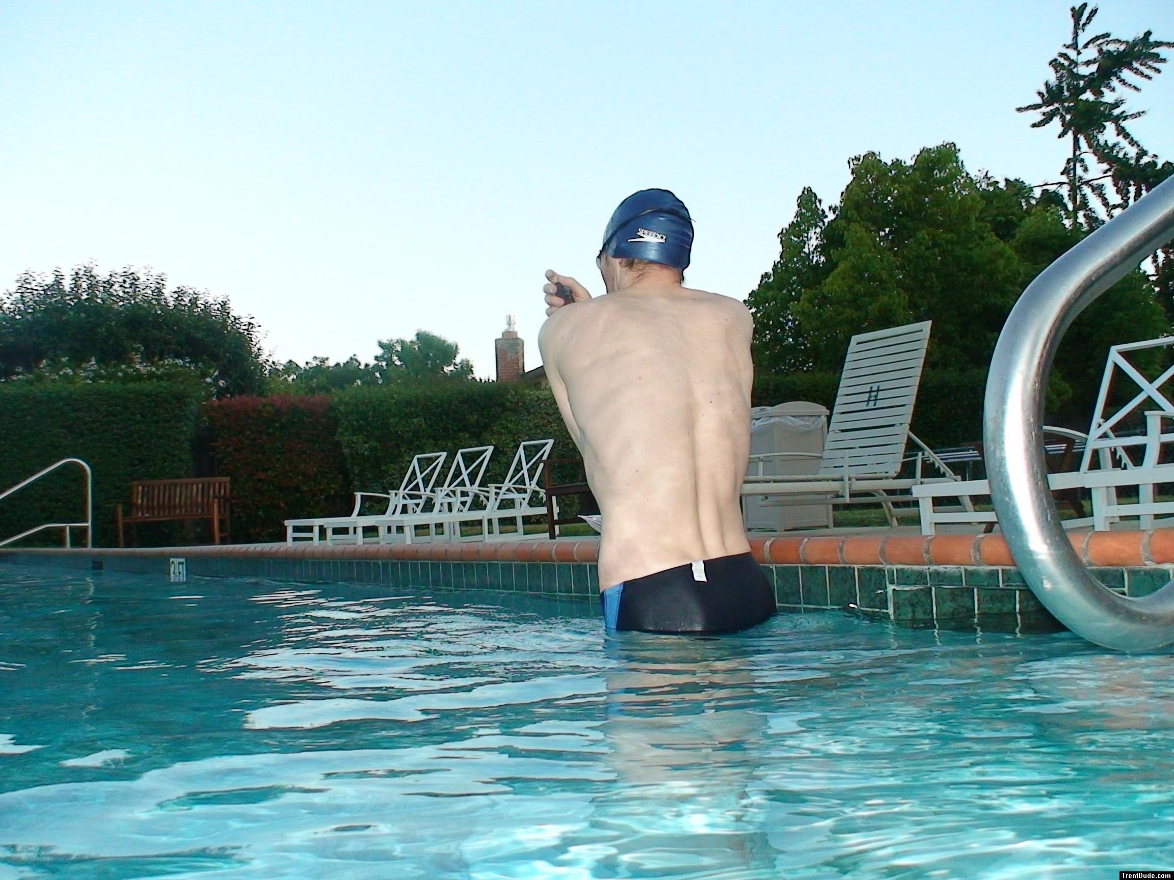 wearing a Nike black/blue speedo swim brief