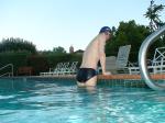 wearing a Nike black/blue speedo swim brief )rear_