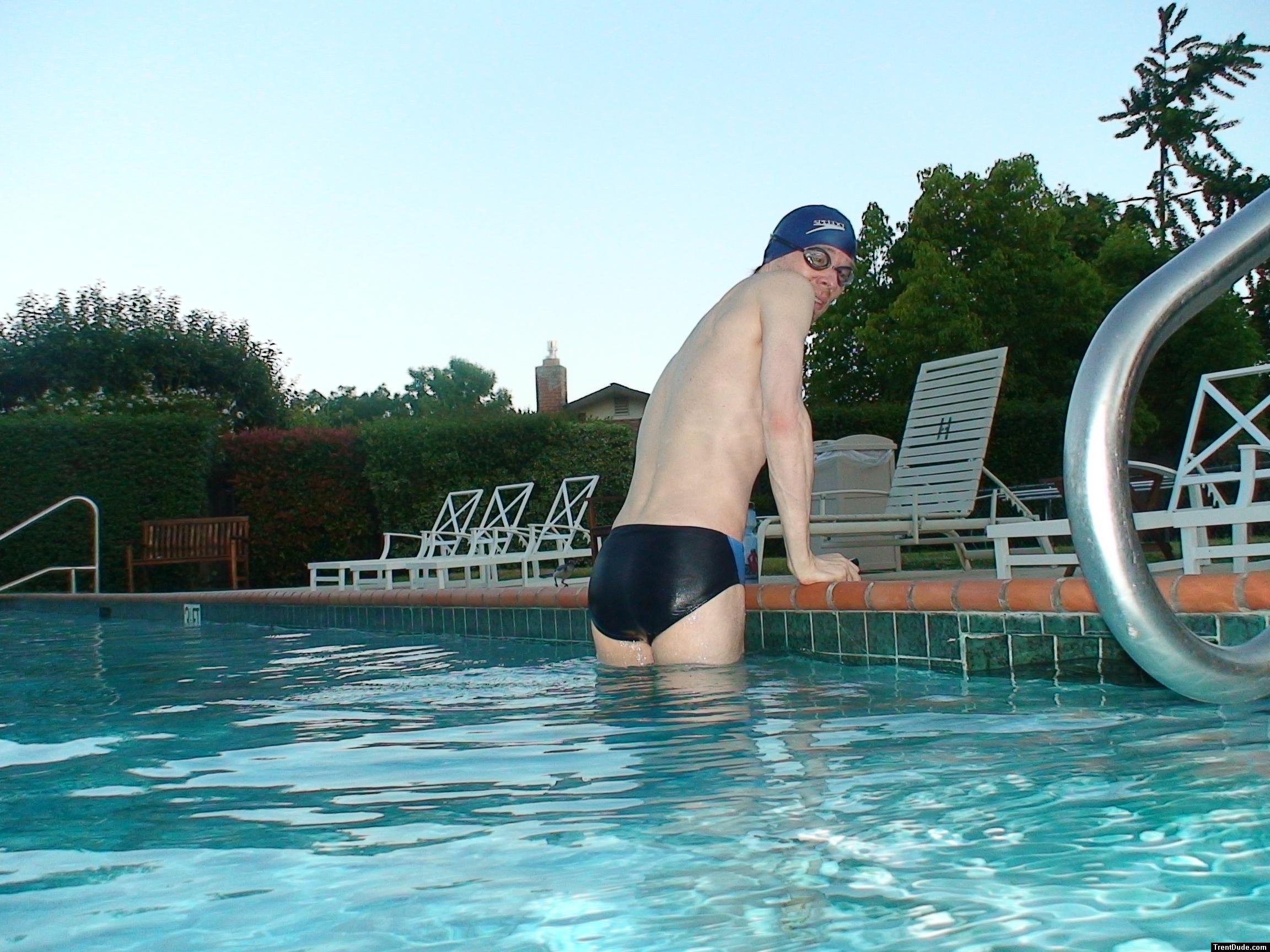 wearing a Nike black/blue speedo swim brief )rear_
