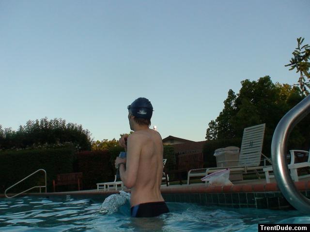 wearing a Nike black/blue speedo swim brief, waves