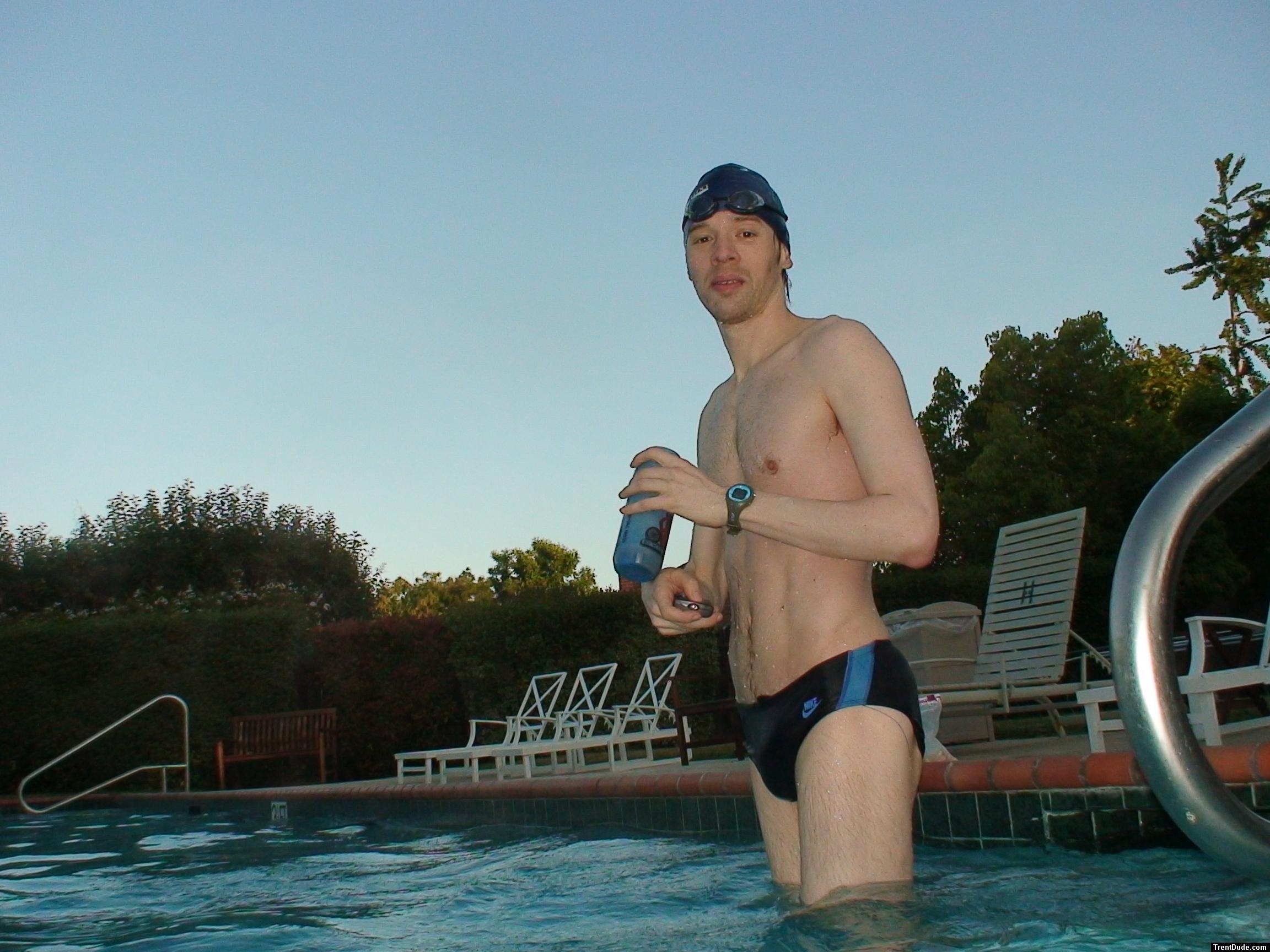 wearing a Nike black/blue speedo swim brief