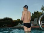 wearing a Nike black/blue speedo swim brief