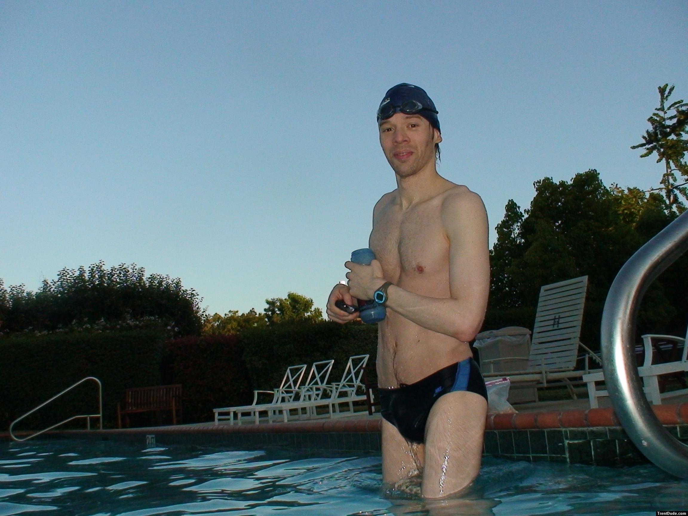 wearing a Nike black/blue speedo swim brief