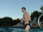 wearing a Nike black/blue speedo swim brief