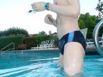 closeup, wearing a Nike black/blue speedo swim brief (unshaven)
