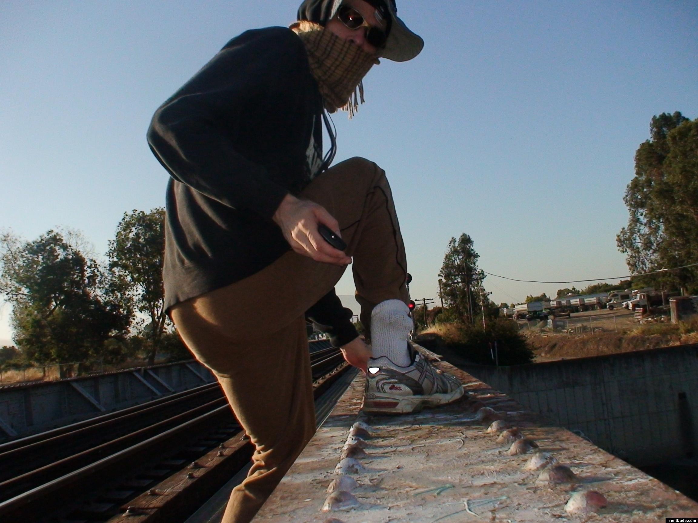 Brown sweats (rear), on a train tressle bridge