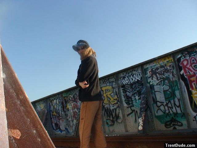 Brown sweats on train trestle, Oregon Research Helios sun hat, Christian Dior Monsieur Cashmere scarf