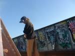 Brown sweats near lots of graffiti