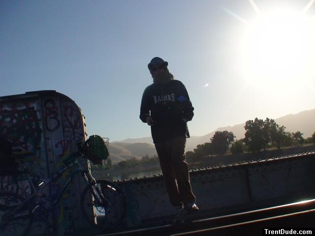 Brown sweats, raiders jersey, mountains