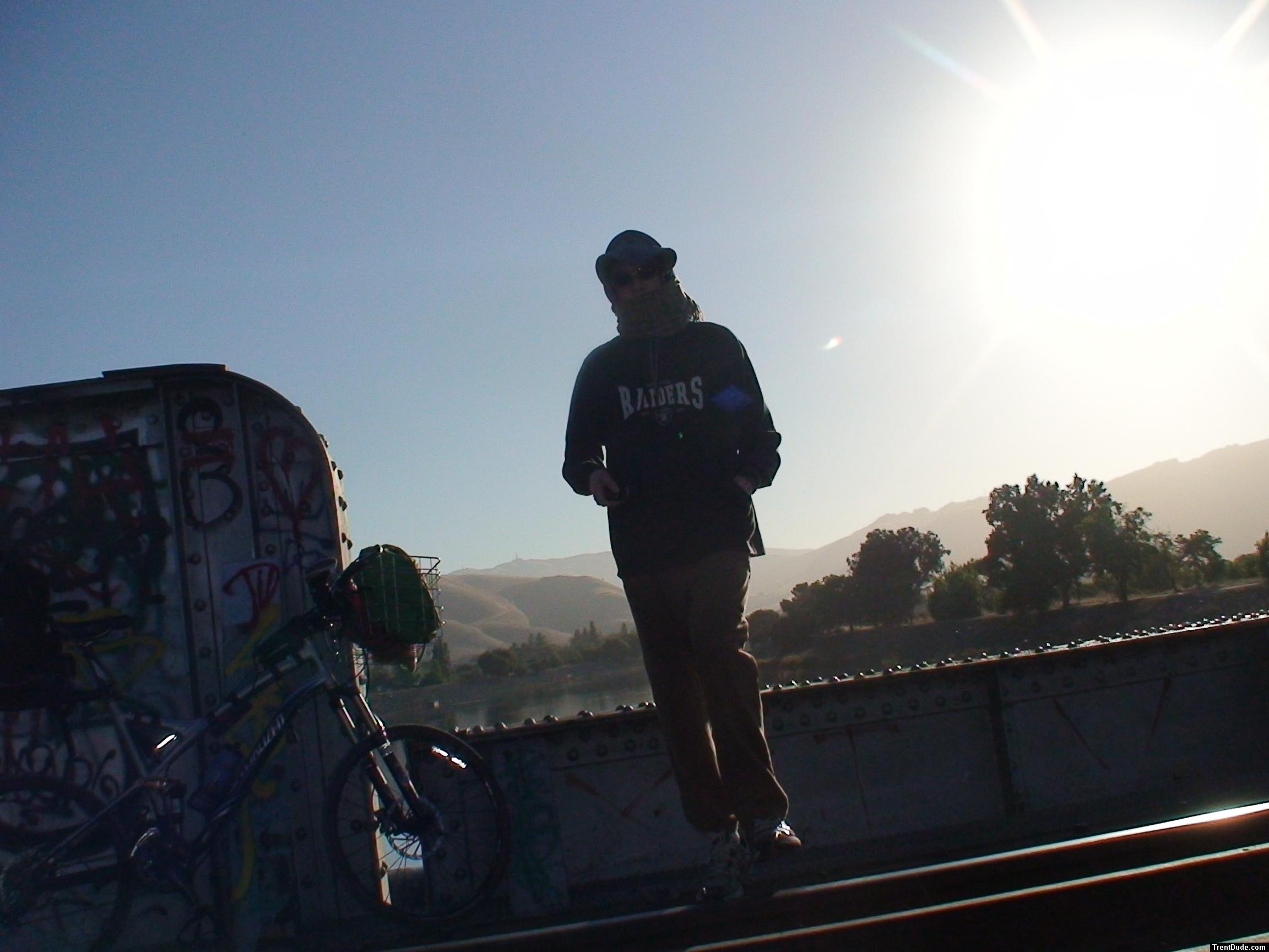Brown sweats, raiders jersey, mountains
