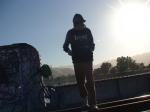 Brown sweats, raiders jersey, mountains