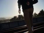 Brown sweats on train tracks