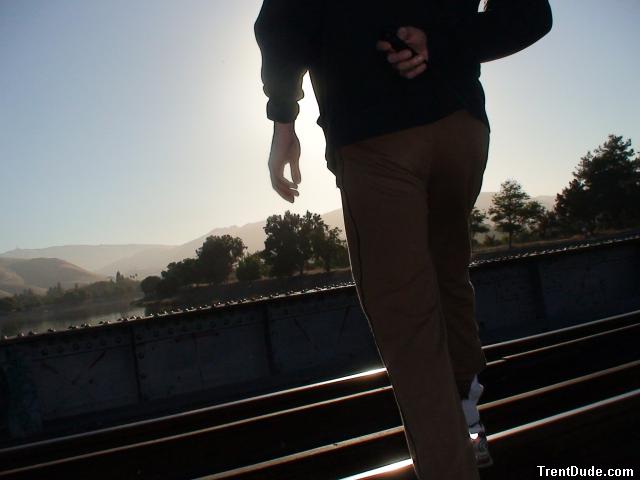 Brown sweats on train tracks
