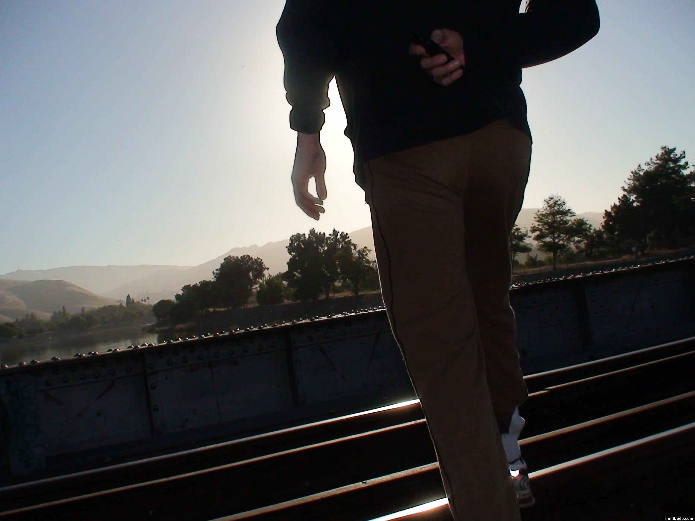 Brown sweats on train tracks