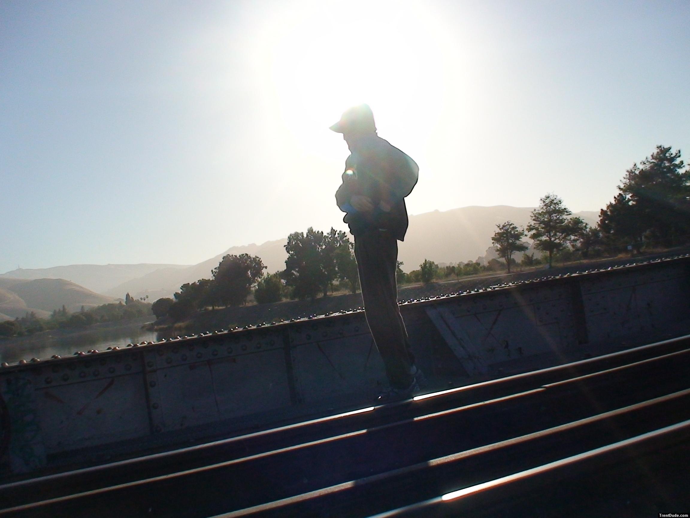 Brown sweats, raiders jersey, mountains