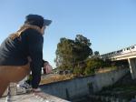 Brown sweats on train trestle (rear), Ascis Gel Evolution 3 shoe (TN7A2), Oregon Research Helios sun hat, Christian Dior Monsieu