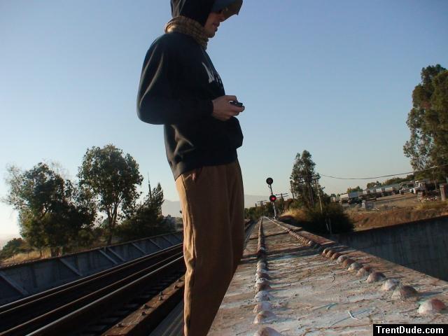 Brown sweats on train trestle, Oregon Research Helios sun hat, Christian Dior Monsieur Cashmere scarf