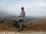 Photoshoot 23 on a mountain top wearubg Blue Addidas shorts, Reebok long sleve shirt