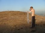 farmhand putting on sweat shirt