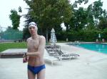 Blue Nike speedo, white swim cap