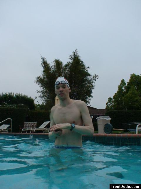 Blue Nike speedo, white swim cap