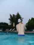 Blue Nike speedo, white swim cap