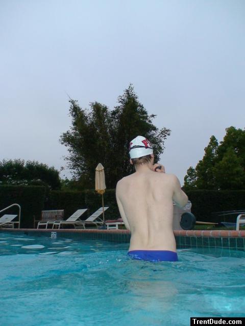 Blue Nike speedo, white swim cap