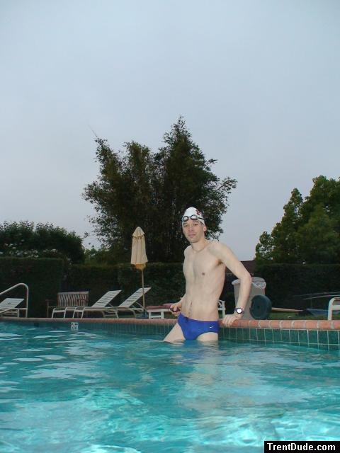 Blue Nike speedo, white swim cap